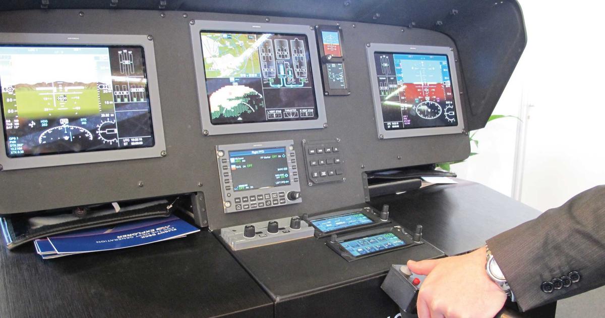 The Universal cockpit incorporates a cyclic-mounted cursor control device instead of a touchscreen.  