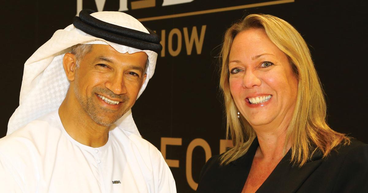 Middle East Business Aviation Association founding chairman Ali Al Naqbi (left)and F&E Aerospace managing director Michele van Akelijen highlight the new MEBAA show logo to be introduced for the 2016 edition. Photo: David McIntosh