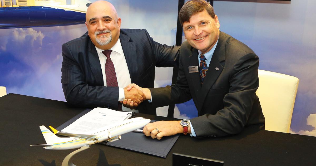 Comlux president and CEO Richard Gaona (left) signs a contract for BBJ Max 8 jets with outgoing Boeing Business Jets president Steve Taylor. The deal marks a shift for the European operator, which has mainly been an Airbus operator.  (Photo: David McIntosh)