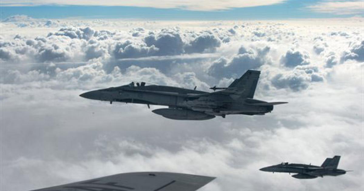 Two Canadian F-18C Hornet fighters over Iraq, as seen from a U.S. Air Force KC-135. (Photo: U.S. Air Force)