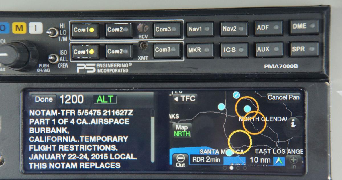 The L-3 Aviation Products NGT-9000 ADB out/in touchscreen display transceiver during an inflight demo, with upcoming TFRs indicated by yellow/amber circles. (Photo: Matt Thurber)