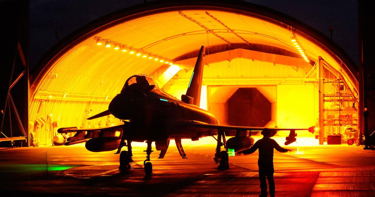 A Royal Air Force Typhoon leaves its shelter at night. The UK is seeking long-term support contracts. (Photo: Eurofighter)