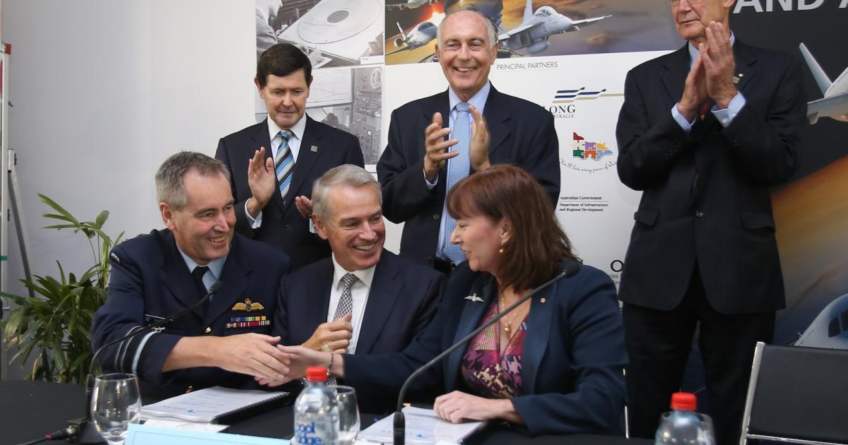 Principals celebrate the selection of Thales Australia to supply the OneSky program at Avalon 2015. (Photo: Airservices Australia)