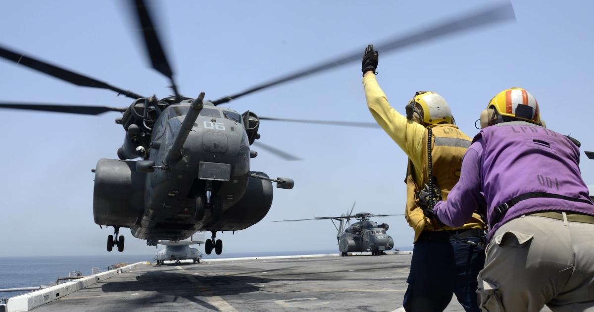 An MH-53E Sea Dragon lands on the deck of the amphibious transport dock ship USS Mesa Verde. (Photo: U.S. Navy)