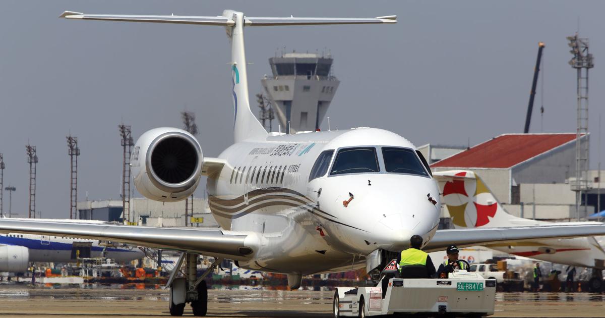 Embraer’s Legacy 650 makes its grand entrance to the static area of ABACE 2015.