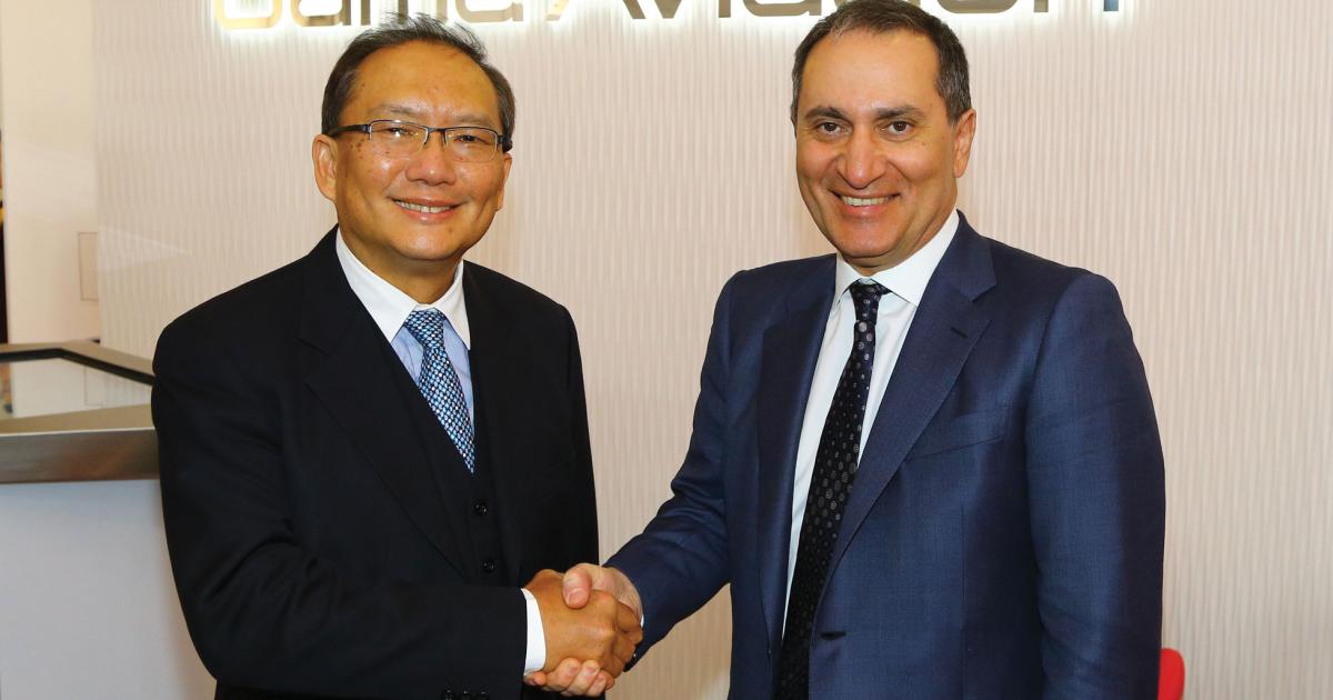 Simon To (l) , managing director of Hutchison Whampoa (China), celebrates an aircraft management joint-venture deal with Marwan Khalek, CEO of Gama Aviation.