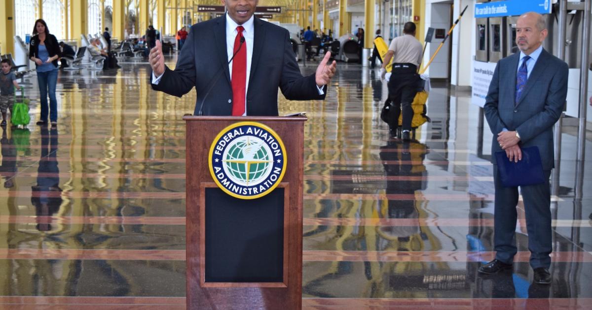 Transportation Secretary Anthony Foxx addresses an audience at Washington Reagan National Airport as FAA Administrator Michael Huerta, r, watches. (Photo: Bill Carey)
