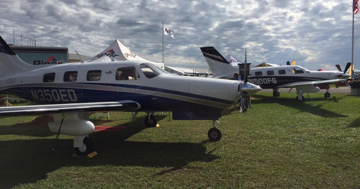 Piper Aircraft's M350 and M500 Piper Aircraft's new M-Class airplanes made their public debut this week at Sun 'n' Fun 2015. The M500, shown in the background, was accompanied by the first production M350. Piper is also showing an M600 mockup. (Photo: Chad Trautvetter/AIN)