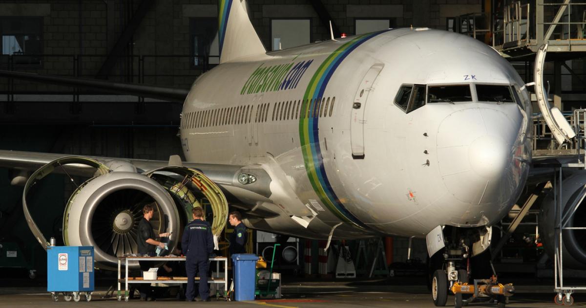 Mechanics work on a Transavia Boeing 737 in Hangar 4 at Amsterdam’s Schiphol International Airport. (Photo: Flickr: <a href="http://creativecommons.org/licenses/by-nc/2.0/" target="_blank">Creative Commons (BY-NC)</a> by <a href="http://flickr.com/people/dirkjankraan" target="_blank">dirkjankraan.com</a>)