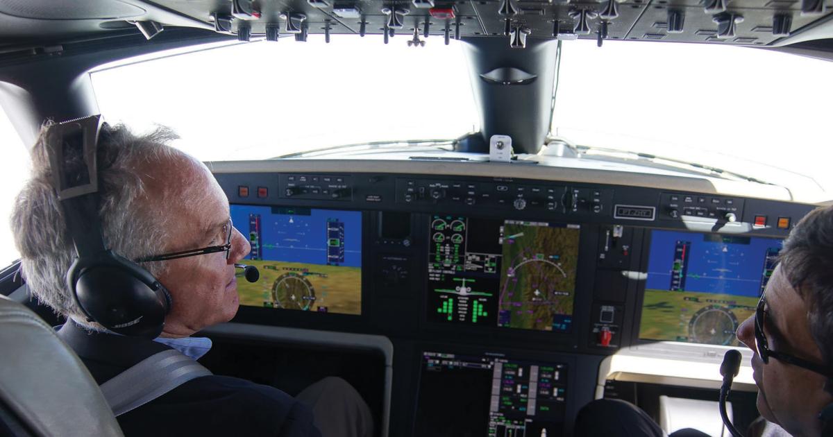 High above the Brazilian jungle, AIN senior editor Matt Thurber, left, put the Legacy 500 through its paces. The Rockwell Collins Pro Line Fusion flight deck makes for a comfortable workspace for Legacy pilots.