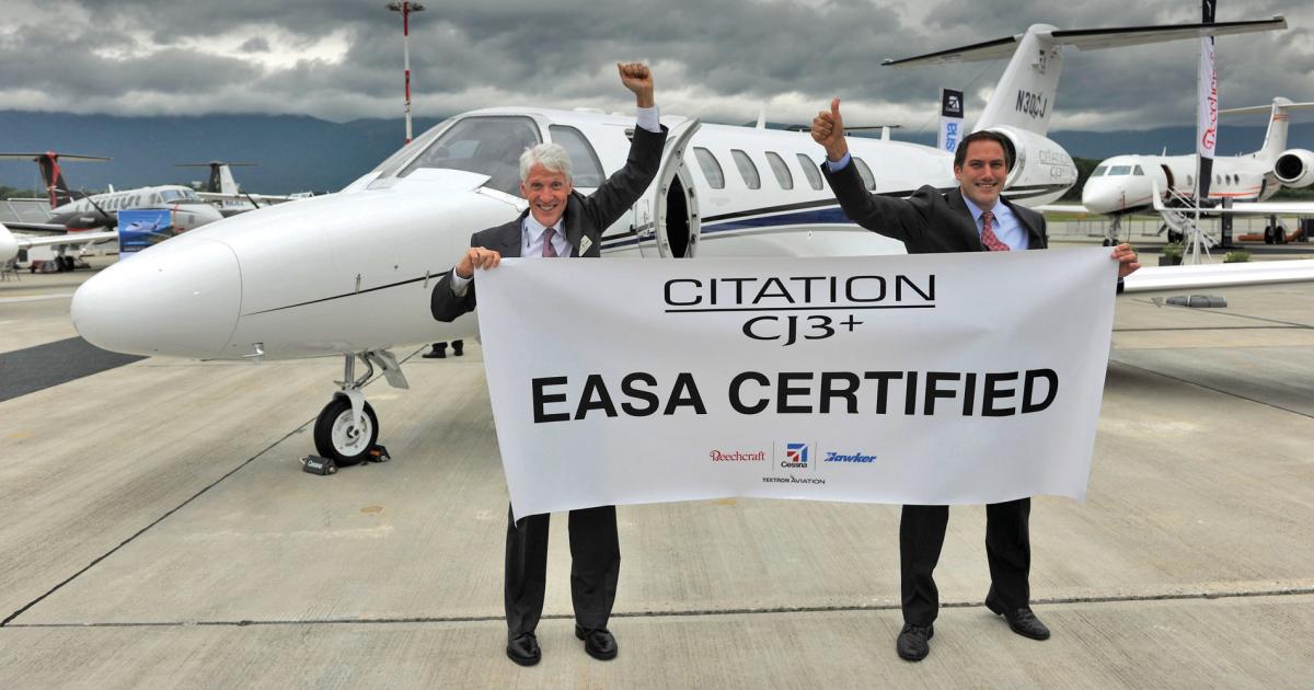 Tom Perry, left, v-p of European sales for Textron Aviation shares the good news on the CJ3+ with Chris Hearne, Cessna v-p for jets and interior engineering.