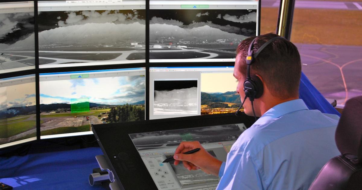 A controller mans a remote tower working position, which provides a real-time display of a distant airport surface. (Photo: Frequentis)