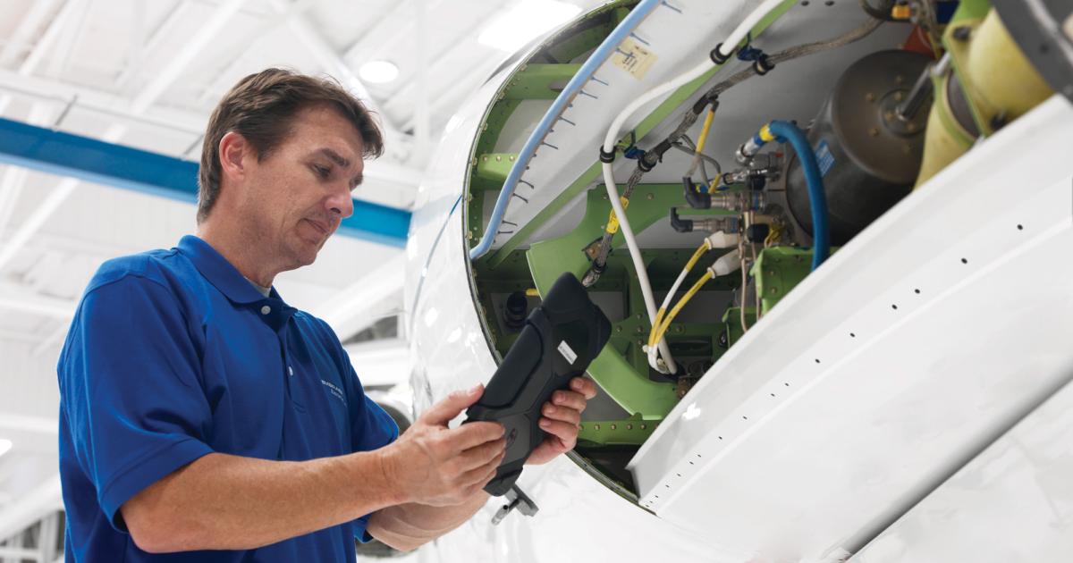 Tablet devices are not popular only with the flight crew; mechanics are using the latest technology to keep up with aircraft condition and ultimately reduce the downtime required for maintenance. (Photo: Embraer)