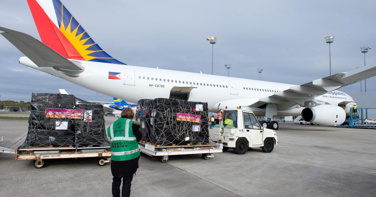 A cargo handler loads a Philippine Airlines Airbus A330. The Filipino government hopes to fast-track airport development. (Photo: Airbus)