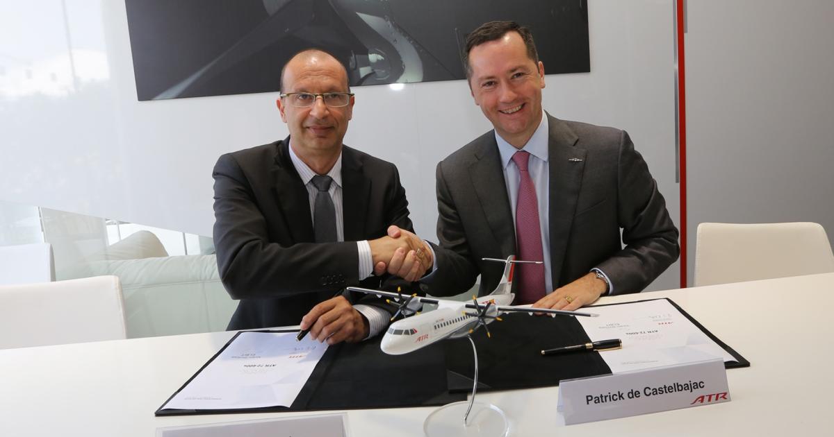 Elbit Systems aerospace division general manager Yoram Shmuely (left) and ATR chief executive Patrick de Castelbajac celebrate the signing of a deal to collaborate on a new wearable display for ATR 600 Series turboprops. (Photo: ATR)