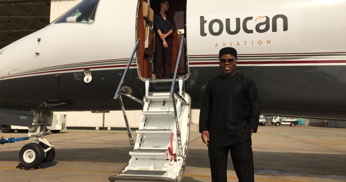 Toucan CEO Achuzie Ezenagu takes delivery of the first of six ERJ145s.