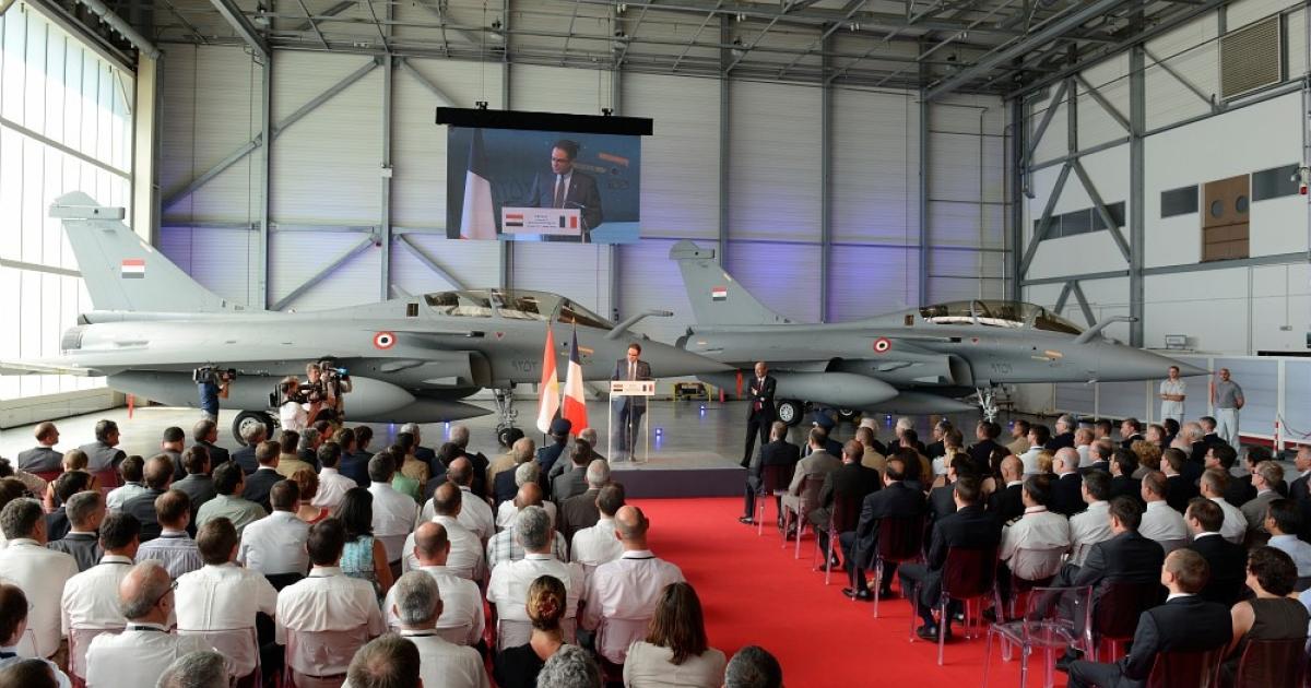A pair of two-seat Rafales formed the backdrop to the delivery ceremony for Egypt’s first aircraft. (Photo: Dassault Aviation) 