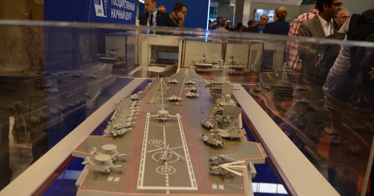 A scale model of a large aircraft carrier on display at a maritime and defense show in St. Petersburg, Russia. (Photo: Vladimir Karnozov)