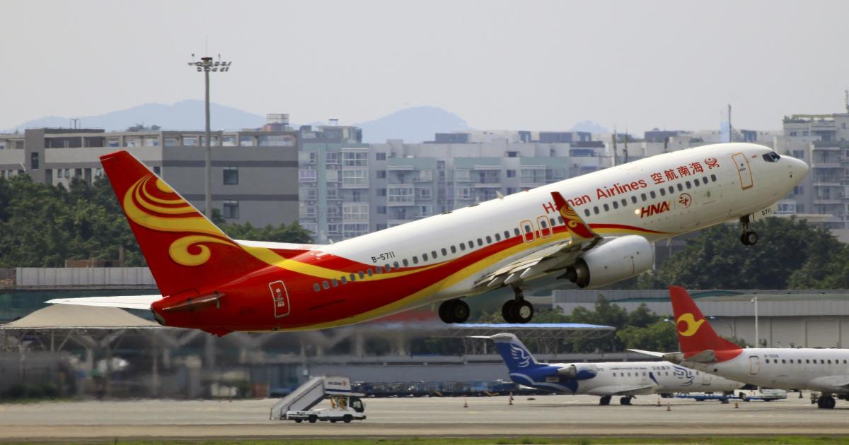 A Hainan Airlines Boeing 737-800 takes off from Chongqing Jiangbei International Airport. (Photo: Flickr: <a href="http://creativecommons.org/licenses/by-sa/2.0/" target="_blank">Creative Commons (BY-SA)</a> by <a href="http://flickr.com/people/byeangel" target="_blank">byeangel</a>)
