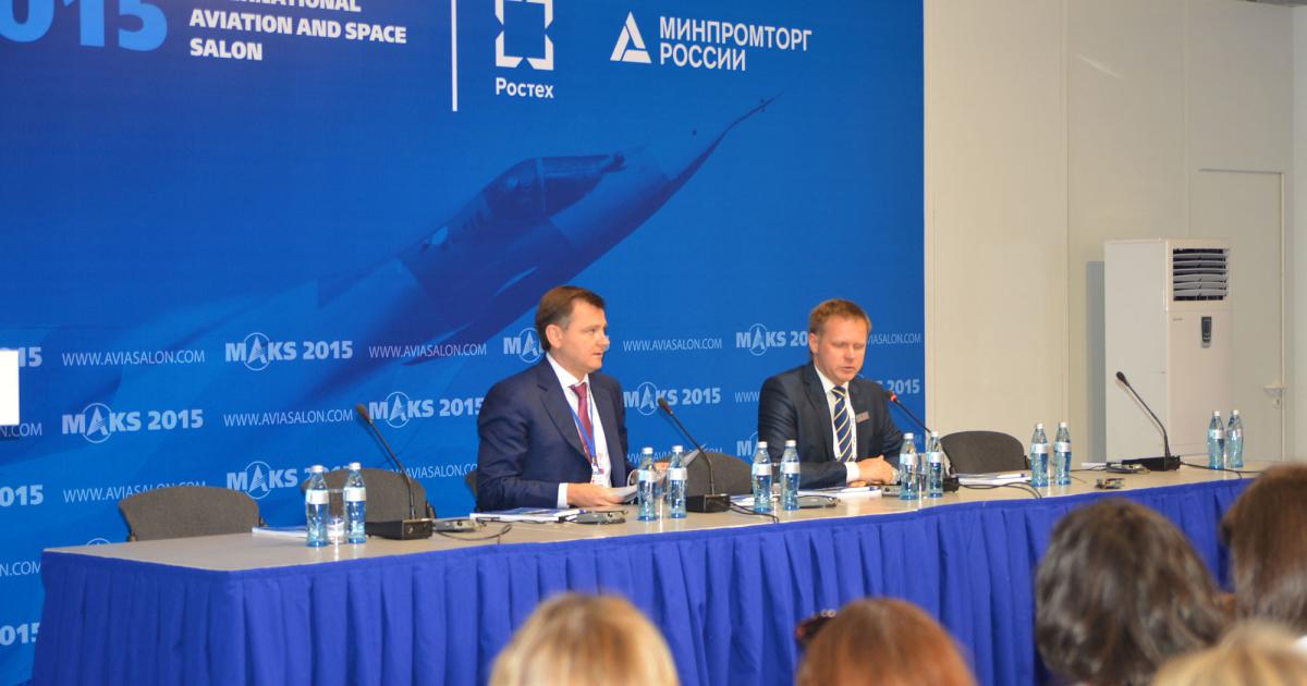 UAC president Yuri Slyusar, left, told a MAKS air show press conference in Moscow that the company is seeking Russian government approval to build the 50- to 70-seat Ilyushin Il-114-300 regional airliner. [Photo: Vladimir Karnozov]