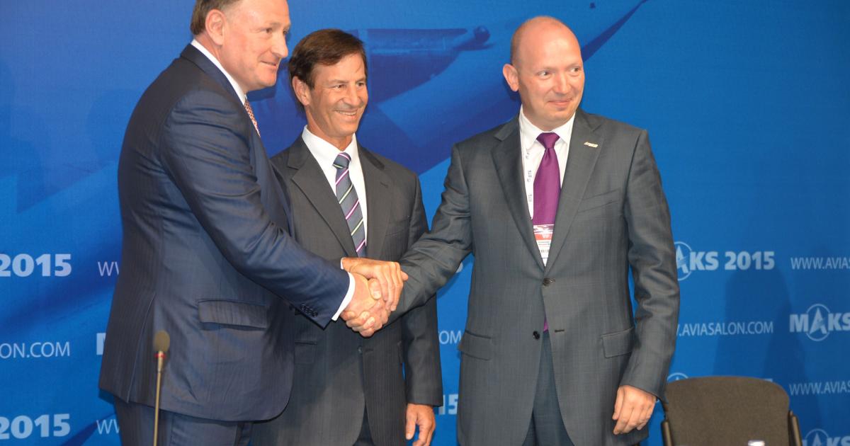 Boeing and VSMPO-Avisma officials celebrate the extension of their partnership at the MAKS show. Left to right: Sergei Kravchenko, Boeing president for Russia and CIS, Marty Bentrott, Boeing vice president, sales for the Middle East, Russia and Central Asia and Mikhail Voevodin, VSMPO-Avisma CEO. (Photo: Vladimir Karnozov)
