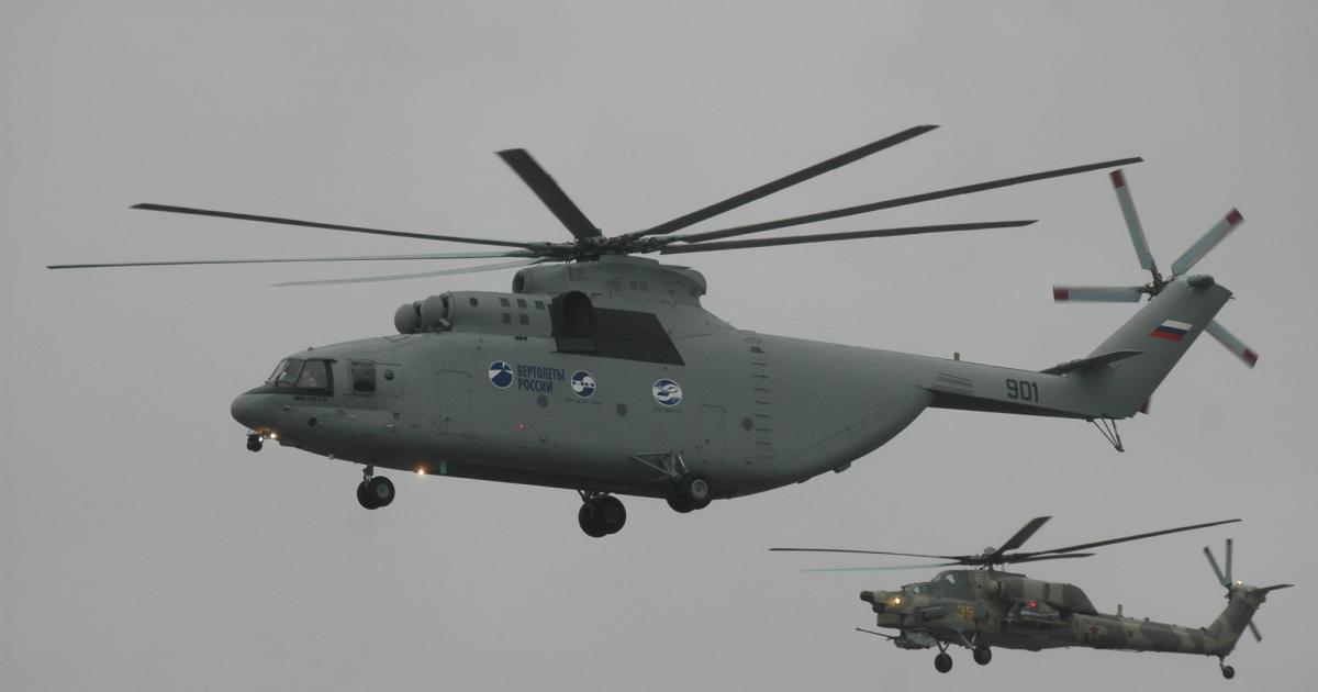 A Mi-26T2 used for development flies with a Mi-28N attack helicopter. Algeria is buying the former and, according to reports, also the latter. (Photo: Vladimir Karnozov)