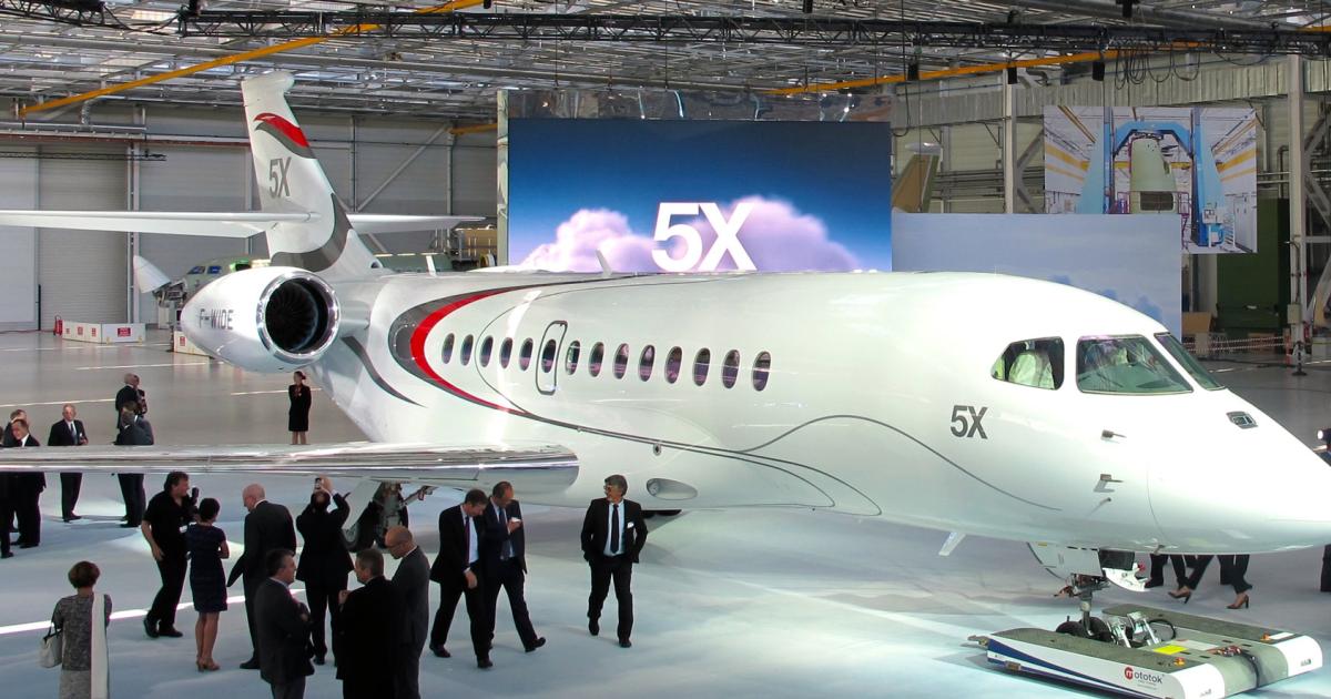 When it rolled out the Falcon 5X in June, Dassault said the first flight was pegged for September, but engine issues have delayed that schedule. The immediate problem with the Snecma Silvercrest turbofans involves slight deformation of the engine casing found during high-temperature testing. (Photo: Thierry Dubois/AIN)