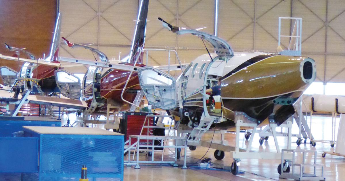 Left, the TBM 900 assembly line in Tarbes. Below, a fuselage awaits mounting of the PWC PT6. The aircraft was announced in April 2014; the 100th copy will be delivered next month. 
