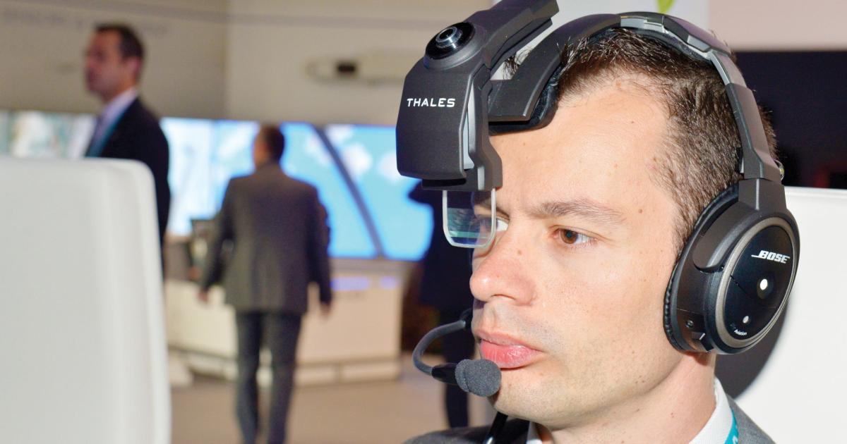 Thales is offering demonstrations of its head-worn TopMax HUD on a Bose noise-canceling headset.