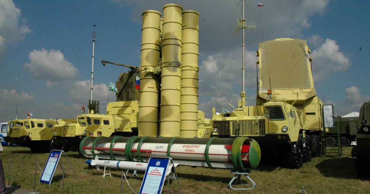 An S-300PMU-2 system on display, with its 48N6E2 and 96N9 missiles in the foreground. (Photo: Vladimir Karnozov)