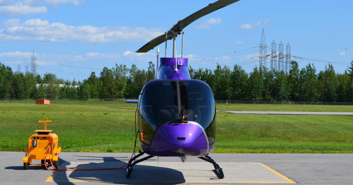 Three Bell 505s, including this purple-colored flight-test vehicle 3 (FTV3), have logged 485 flight hours and another 115 on the ground. FAA certification of the new light-single helicopter is expected in the first half of 2016. (Photo: Bell Helicopter)
