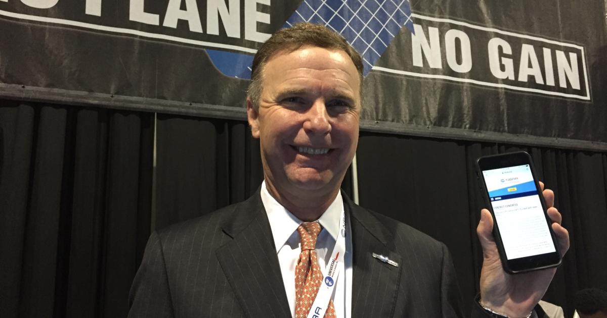 A U.S. bill that aims to privatize air traffic control would inevitably cede control of airspace and airport access to the airlines, with the likely result limiting business aviation's access, said NBAA president and CEO Ed Bolen. He is urging the business aviation industry to use NBAA's Contact Congress page, shown here on his smartphone, to tell their U.S. representatives that they oppose ATC privatization. (Photo: Chad Trautvetter/AIN)