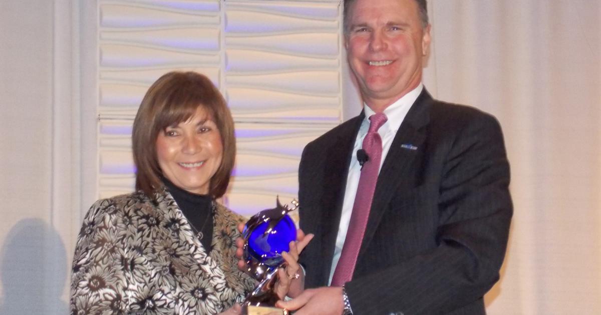 NBAA president and CEO Ed Bolen presented the association’s Schedulers and Dispatchers Outstanding Achievement and Leadership Award to Dorette Kerr at the 2016 NBAA Schedulers & Dispatchers Conference in Tampa, Fla. Kerr is the flight administration manager for John Deere Global Aviation Services and former chair of the NBAA Schedulers and Dispatchers Committee. (Photo: Curt Epstein/AIN)