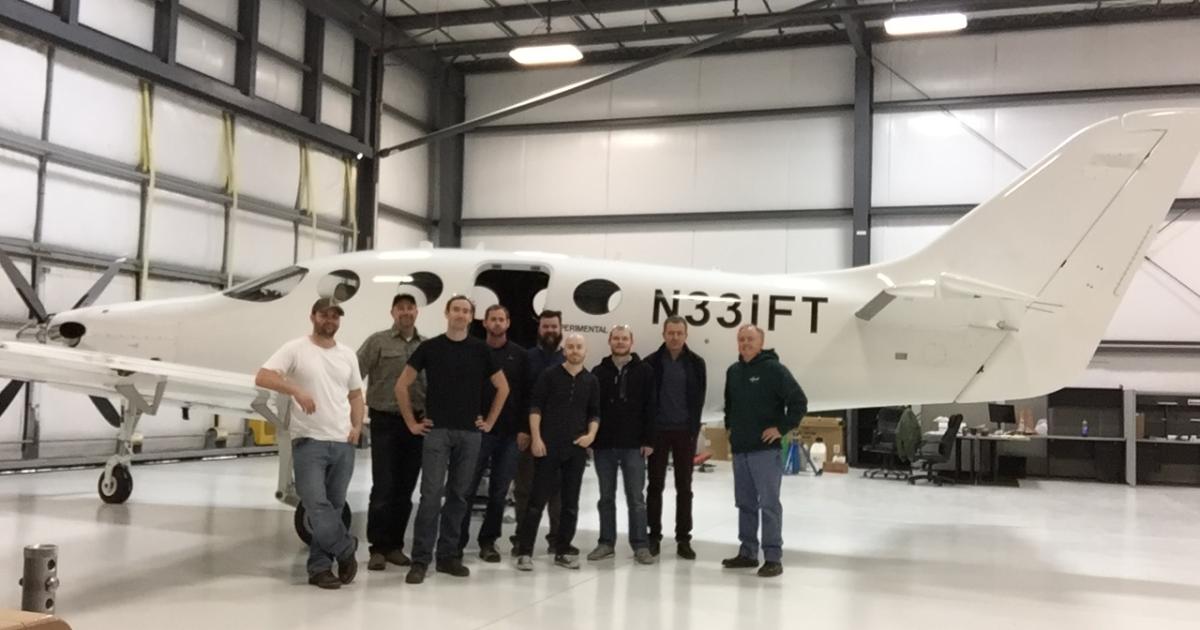 Engineers and the flight test team in front of FT1, the first Epic E1000 prototype.