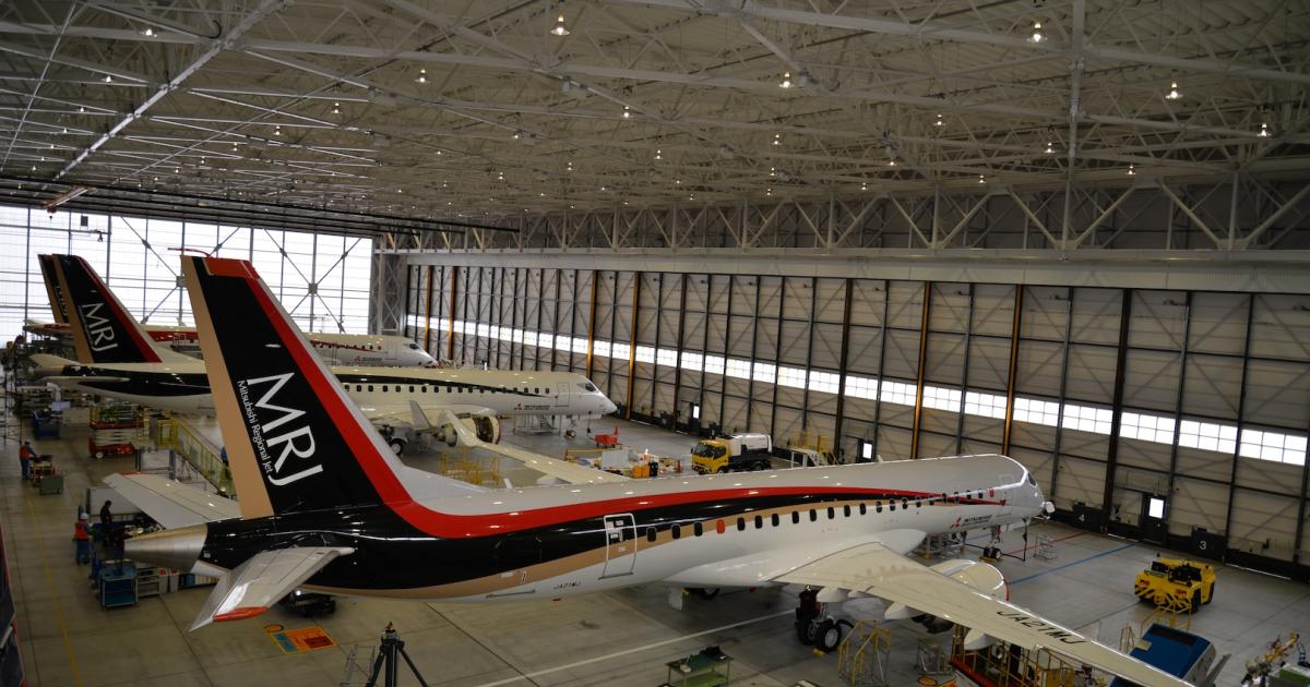 Mitsubishi Aircraft hoped to have re-flown the first modified MRJ (foreground) before the Singapore Airshow opened. The second MRJ (center) also underwent modification, while the third machine (background) continues with functional tests. (Photo: Mitsubishi Aircraft)