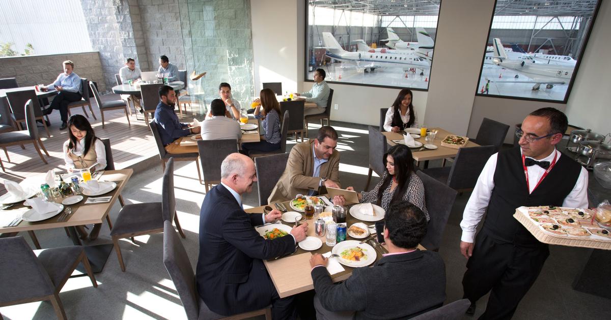 A dining lounge offering views of the hangar and ramp is one of the new amenities at Universal Aviation Mexico's revamped FBO at Toluca International Airport.