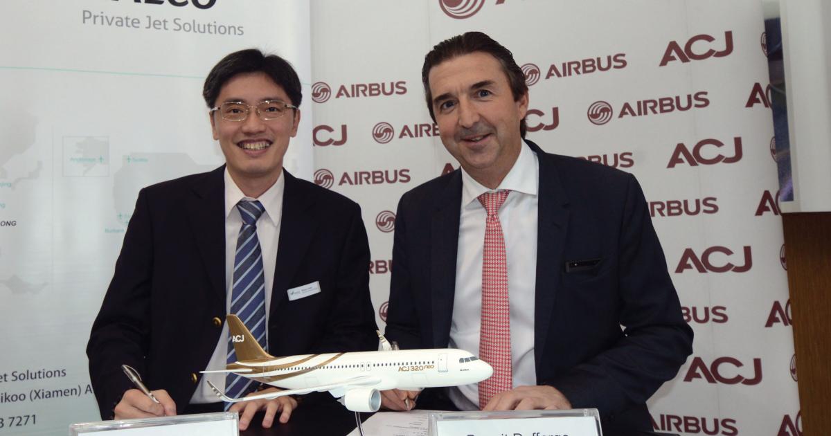 HAECO Private Jet Solutions Executive GM Wilson Chan (left) and Airbus Corporate Jets  president Benoit Defforge pause while discusing their companies’ new relationship. (Photo: Airbus)
