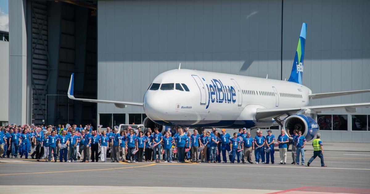 Employees of the Airbus U.S. manufacturing facility gather for the first delivery from the plant of an A321 to JetBlue. (Photo: Airbus)