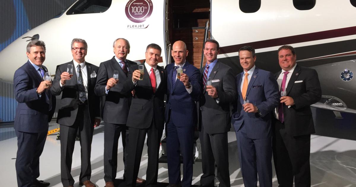 Marco Tulio Pellegrini, Embraer Executive Jets president (center left) and Michael Silvestro, Flexjet’s CEO celebrate the delivery of the 1,000th Embraer business jet (a Legacy 500) today in Melbourne, Fla.