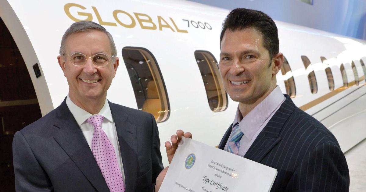 While celebrating European certification of its joint-venture GE Honda Aero HF120, GE Aviation’s Brad Mottier, left, also toasted FAA approval of GE's Passport engine with Bombardier’s David Coleal. The Passport will power the Canadian OEM’s Global 7000.