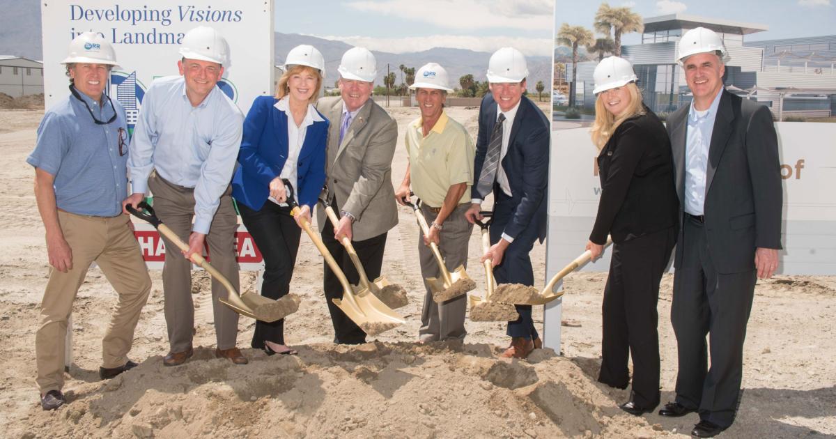 Breaking ground in the desert, Brad Elliott, general manager, Desert Jet Center (third from right), joins Denise Wilson, president and CEO (second from right), and Stuart Illian, v-p of business development (far right), along with local officials and the FBO builders at the official ceremony at Jacqueline Cochran Regional Airport in Thermal, Calif.