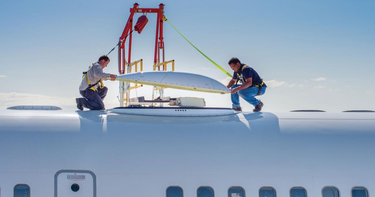 Technicians install the dome above Honeywell’s JetWave system under an FAA supplemental type certificate.