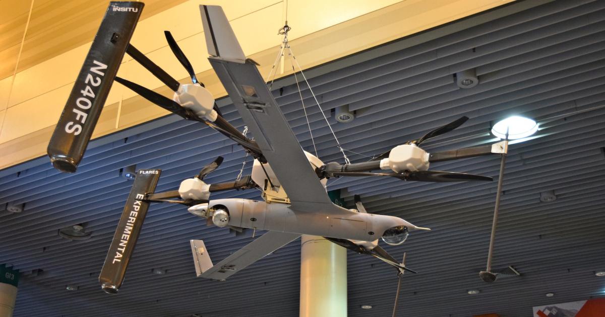 A ScanEagle attached to the Flying Launch and Recovery System is shown above Insitu's exhibit at Xponential. (Photo: Bill Carey)
