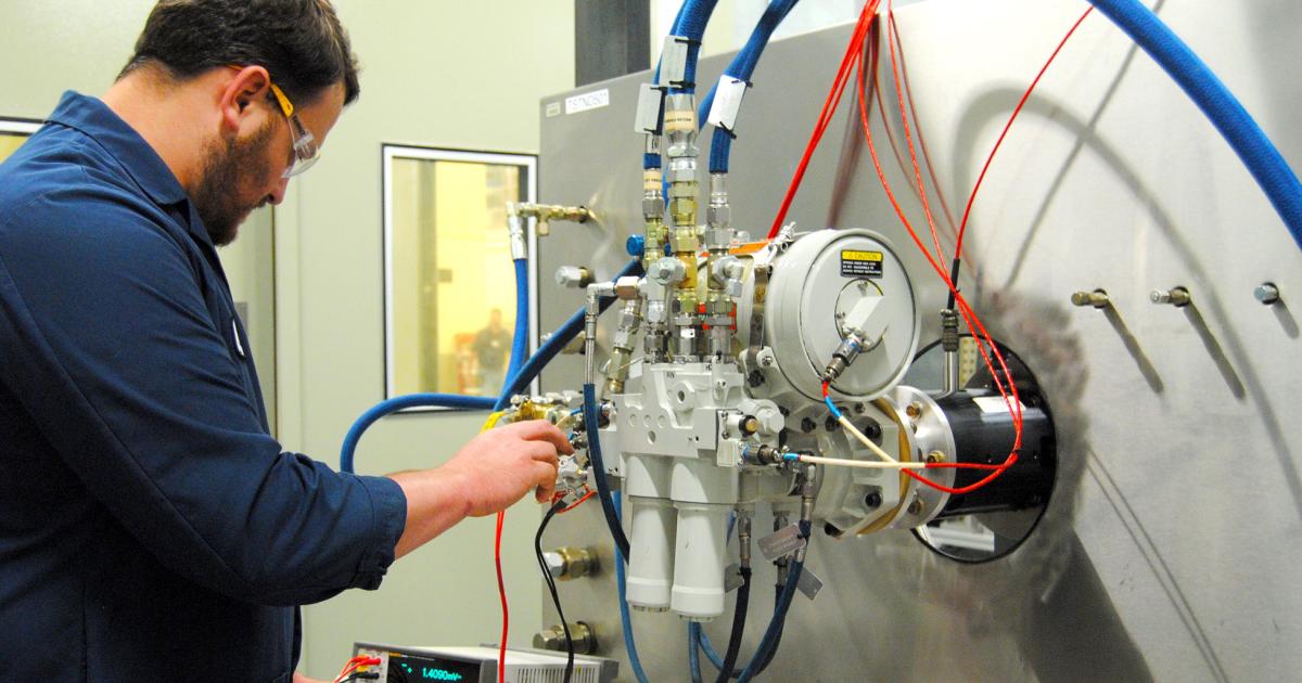 A Triumph engineer performs an electrical check on a hydraulic power pack in the company engineering and test laboratory in Clemmons, North Carolina.
