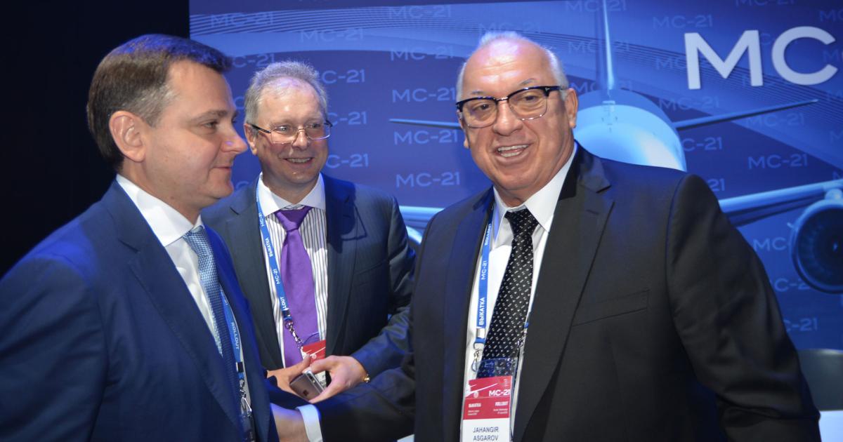 Azerbaijan Airlines CEO Jahangil Asgarov (right) celebrates the deal for 10 MC-21s with IFC general director Alexander Roubstov (center) and UAC president Yuri Slyusar (left).
