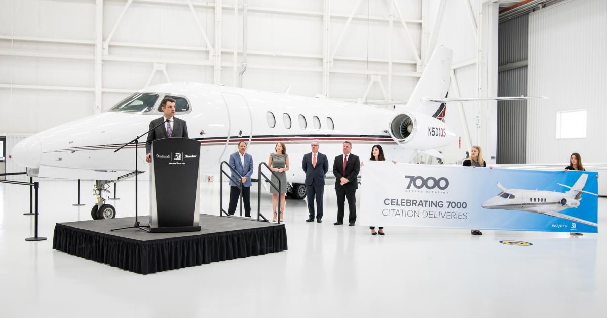 NetJets CEO Adam Johnson took the ceremonial keys to the fractional provider's first Cessna Citation Latitude during a delivery ceremony on June 27 in Wichita. He said the new midsize jet—the milestone 7,000th Cessna Citation—"is a great addition to our fleet." (Photo: Textron Aviation)