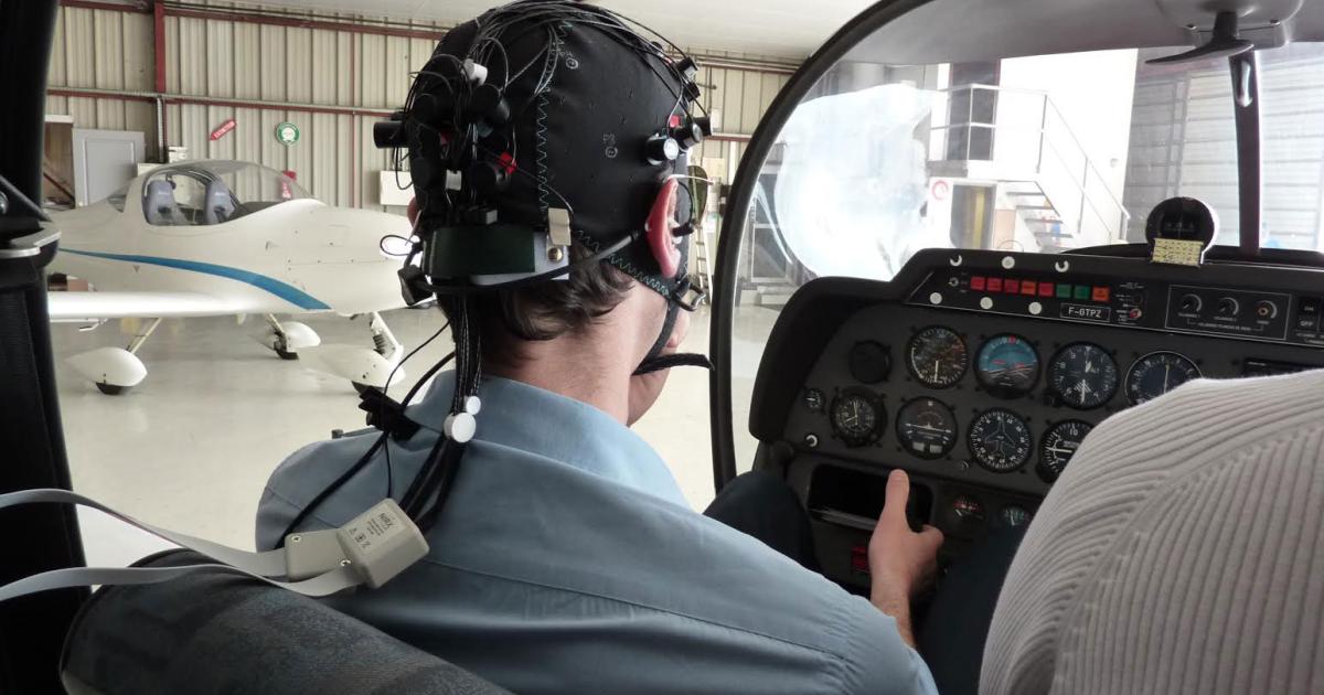 Toulouse-based researchers are monitoring a pilot's brain activity in flight, equipping his head for functional near infrared spectroscopy.