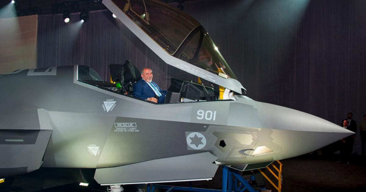 Israeli Defense Minister Avigdor Lieberman in Israel’s first F-35 during the ceremony at Fort Worth. (Photo: Lockheed Martin)
