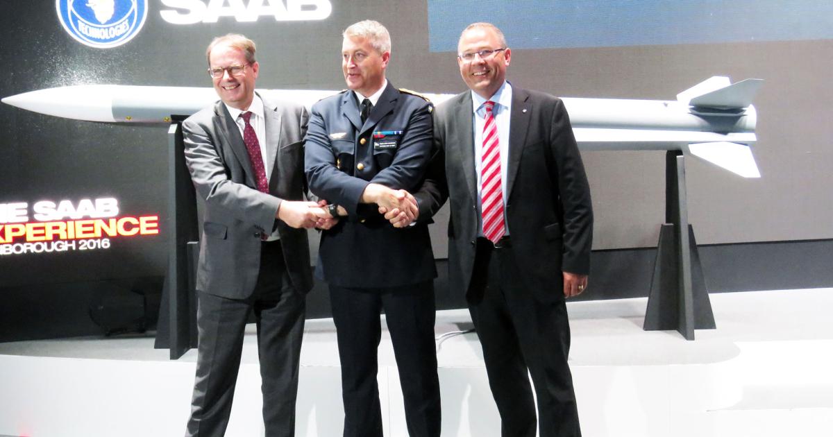 Celebrating Meteor’s service entry is major general Mats Helgesson, Sweden’s air force chief, flanked by the MBDA CEO Antoine Bouvier (left) and Saab CEO Håkan Buskhe (right).