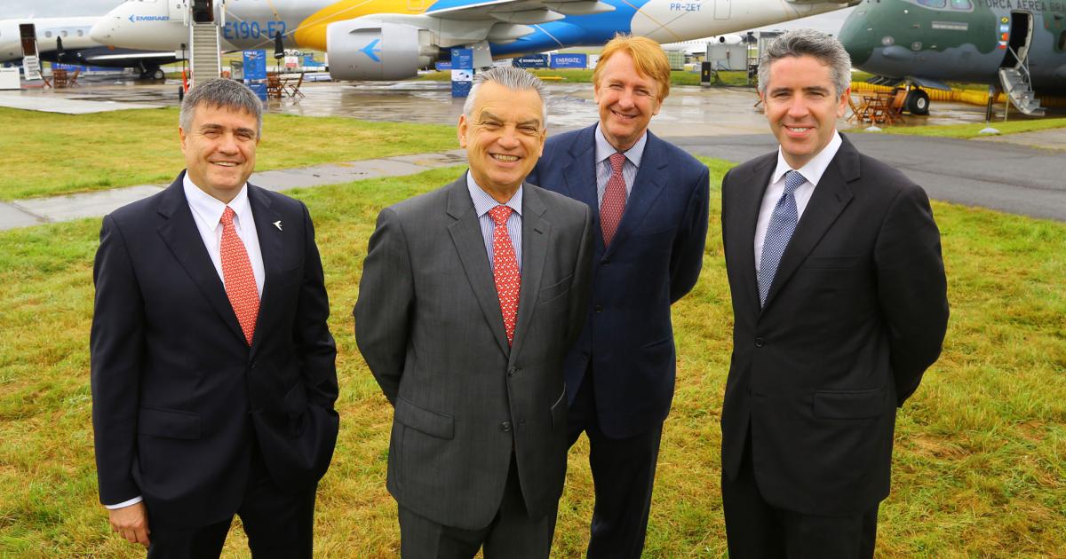 Embraer executives are all smiles. From left: Marco Túlio Pellegrini, president and CEO, executive jets; Paulo Cesar de Souza e Silva, president and CEO; Jackson Schneider, executive v-p, defense and security; John Slattery, president and CEO, commercial aviation.